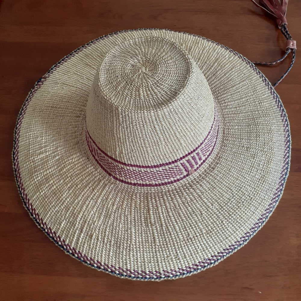 New South American finely woven straw hat with leather drawstring.